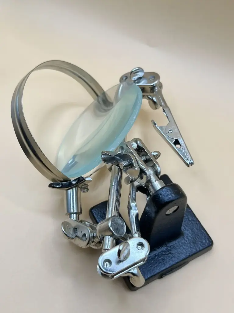 Magnifier stand with three handles